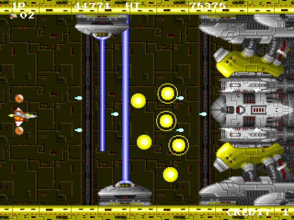 Player facing off against an enormous yellow boss in INFINOS that is trapping the player in with laser beams and shooting yellow orbs of electricity